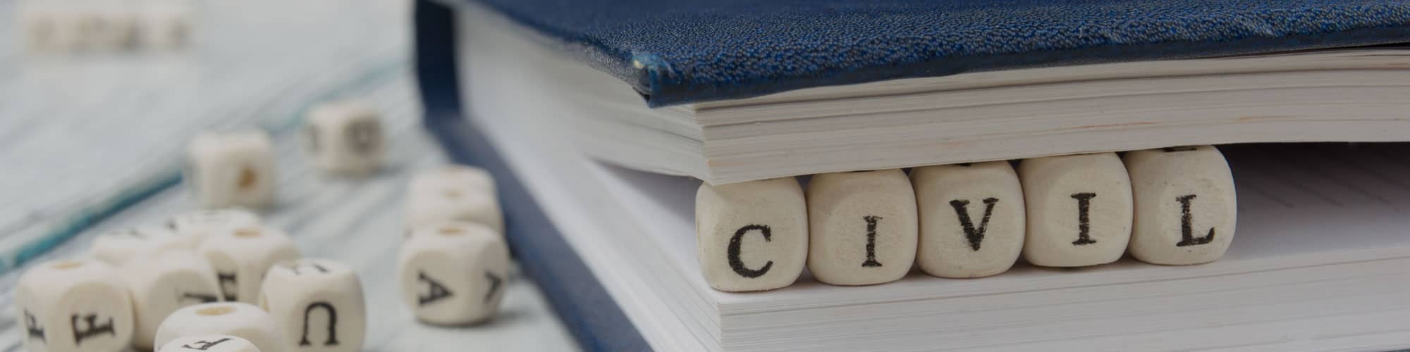 Legal book with letters spelling out Civil