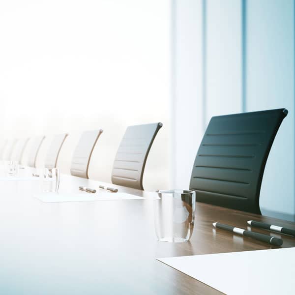 Table and chairs in company boardroom